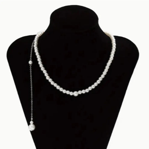 Necklace with long thin chain with pearls on the back
